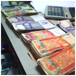 peso bills on table