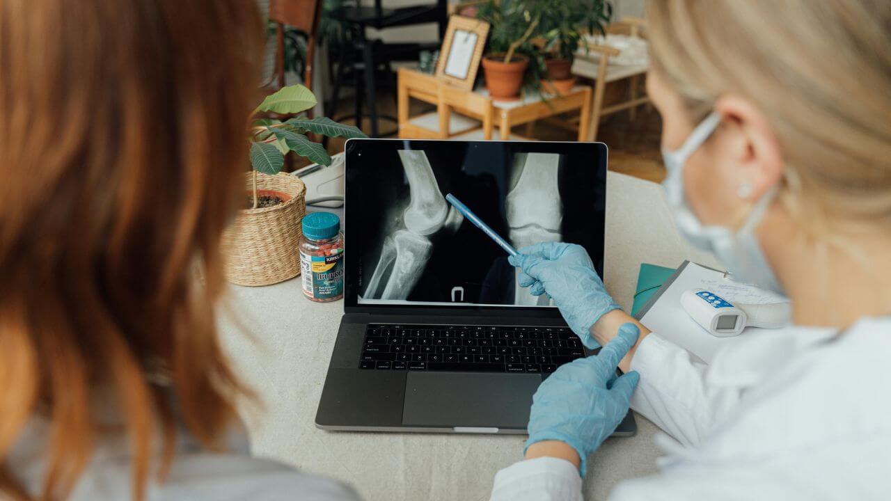 Doctors Examining an X Ray Image on a Laptop